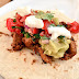 Spicy pork soft tacos with chilli and tomato salsa, guacamole... the works!