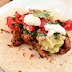 Spicy pork soft tacos with chilli and tomato salsa, guacamole... the works!